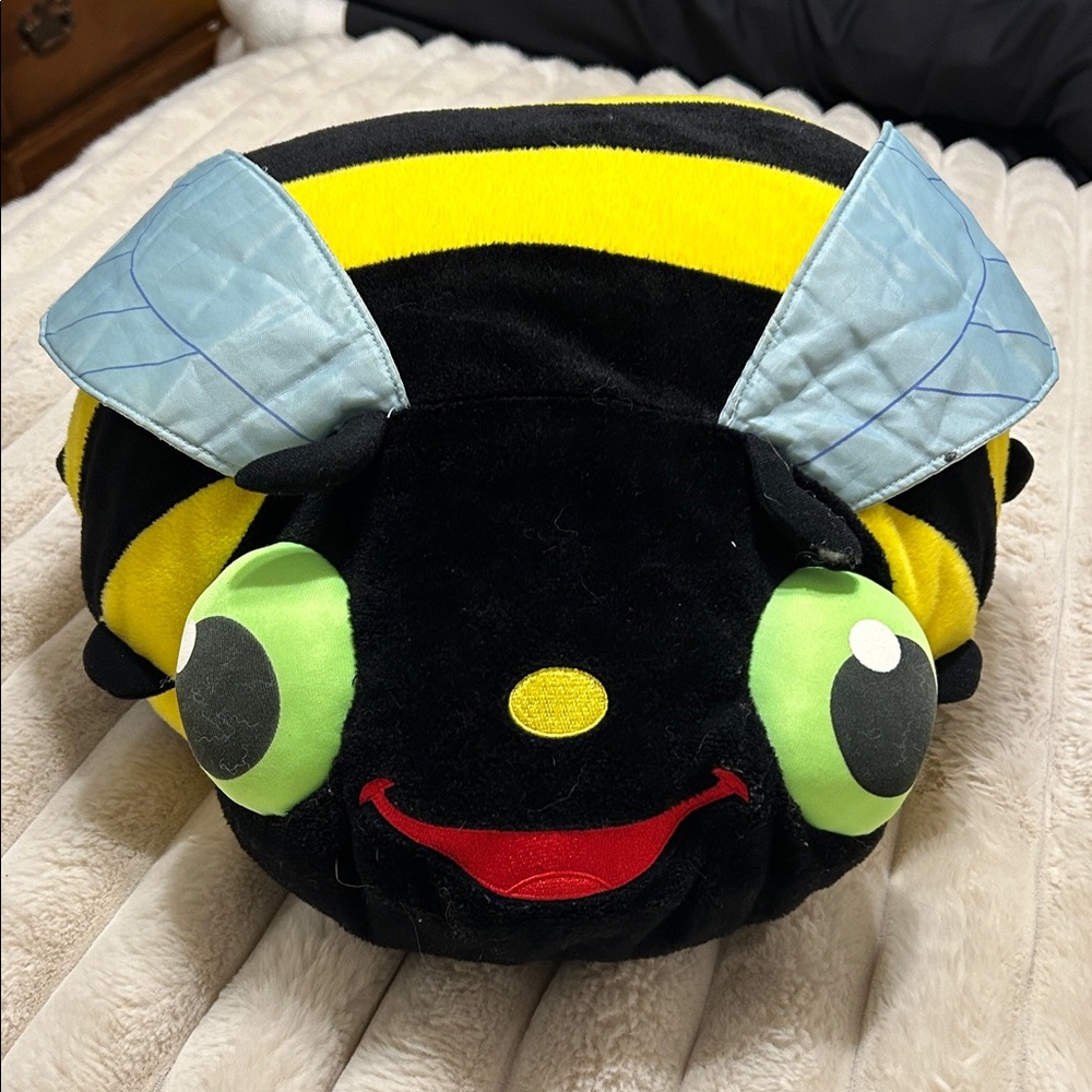 Bee-Themed Yellow and Black bumblebee pillow stuffed with a throw blanket